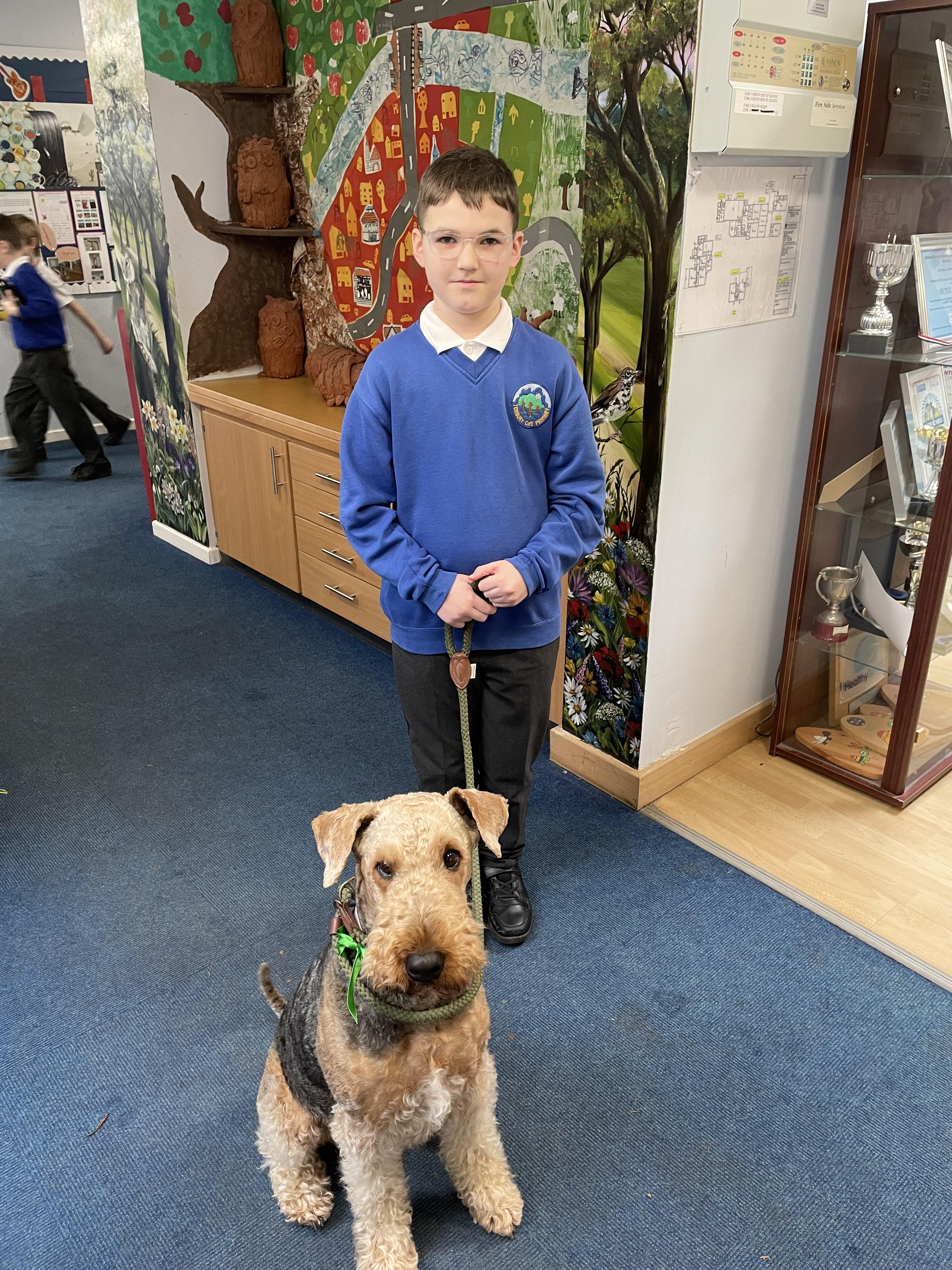 Rosie, our school dog is proudly wearing the green colours of Owls!